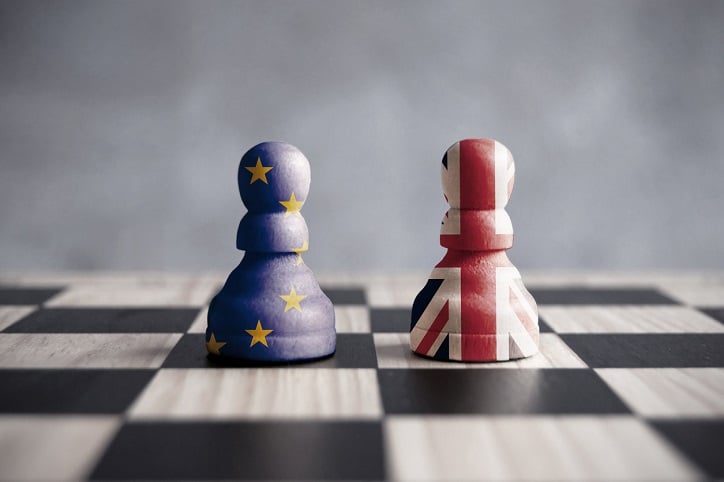 Brexit strategy concept showing two chess pawns with UK and European flags