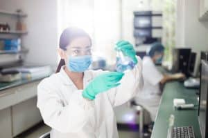 Chinese pharma scientists working in lab.