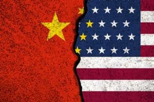Closeup of a crack in USA and China flags. Trade war concept.