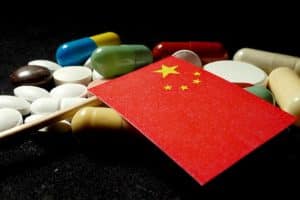 Chinese flag with lot of medical pills