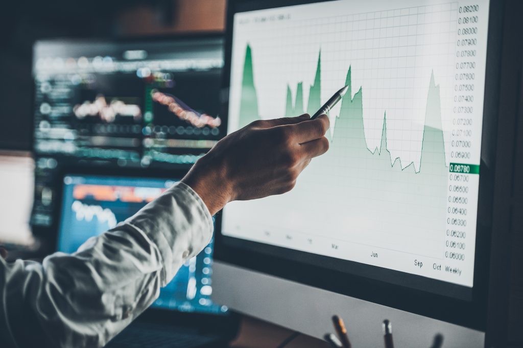 hand pointing with pen at screen with data for SCAIR risk analysis